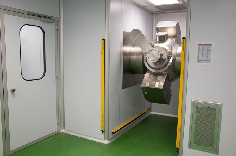 The Criox system can also be mounted through a wall, so that the machine itself is in a dedicated enclosure and only the loading hopper extends into the cleanroom. (Picture: Italvacuum)