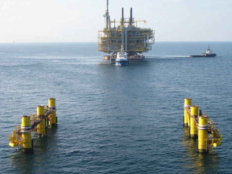 ... an oil rig is transported to its prepared legs on the seabed of the Arabian Gulf... (Picture: NPCC)