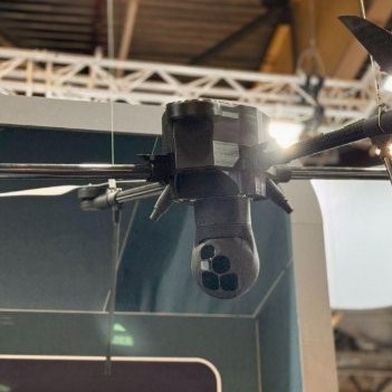 3D-printed plastic prototype of a payload mounted on a real-size drone, Eurosatory 2026 (Source: Tactical Photonics)