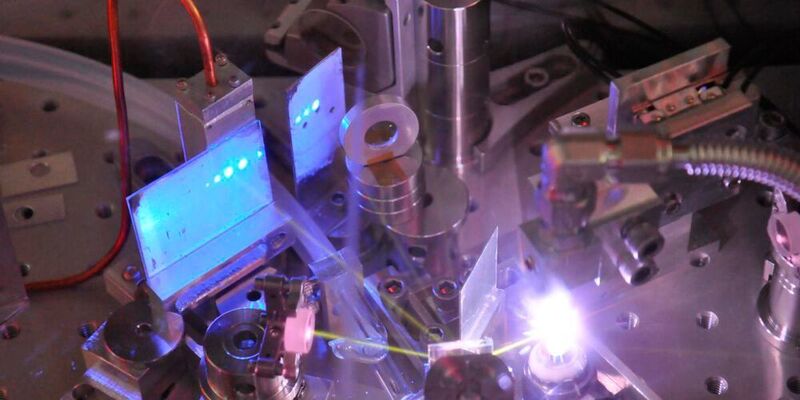 Ultrafast pulses of ultraviolet light in a gas jet are visible as blue dots on a phosphor screen.  (University of British Columbia)