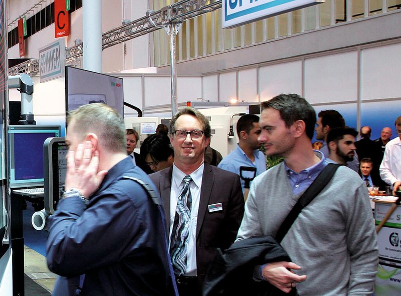 The calm in the storm: Greg Hyatt (c.) helped put DMG Mori in the quickly expanding field of additive manufacturing. (Source: Culp)