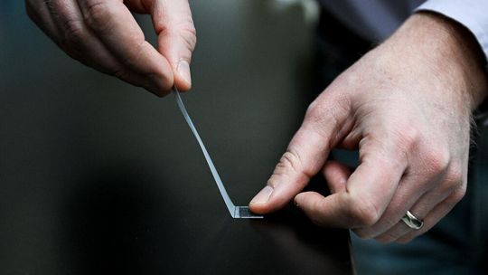 Penn State Associate Professor of Physics Nathan Keim demonstrates how ordinary adhesive tape can form “memories.” (Source:  Jaydyn Isiminger/ Penn State)