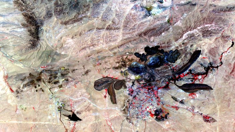 The mine in Baiyun Ebo, Inner Mongolia, China, which is the site of almost half the world's rare earth element (REE) production. The satellite image covers an area of 15 × 19 km.(Source:  Wiki Commons, NASA/GSFC/METI/ERSDAC/JAROS & U.S. / Japan ASTER Science Team, Public domain)
