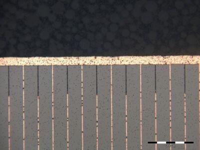 Bild 1: Schnitt durch einen EPCOS Kupfer-Piezo-Aktuator der dritten Generation. Durch selektives Ätzen der Isolationsschichten wird ein höheres aktives Volumen erzielt.  (EPCOS)