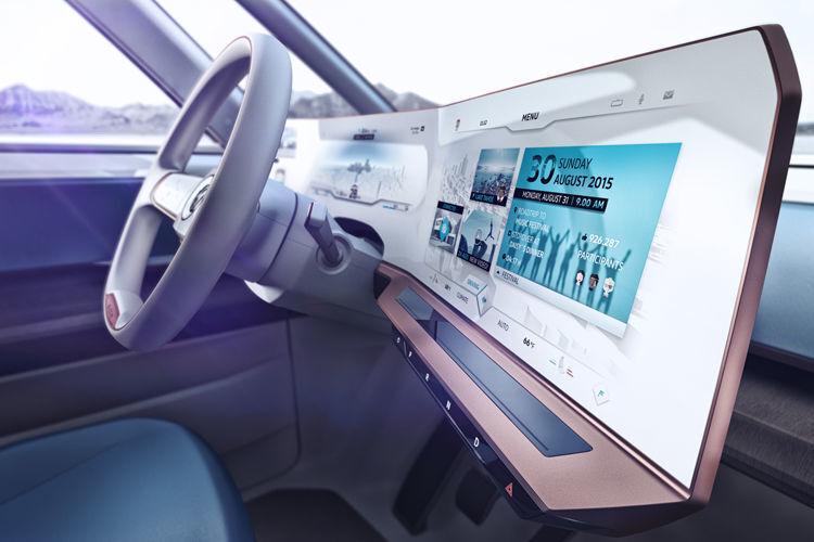 Der Fahrer sitzt in einem futuristischen Cockpit mit überdimensionalen Displays. (Foto: VW)