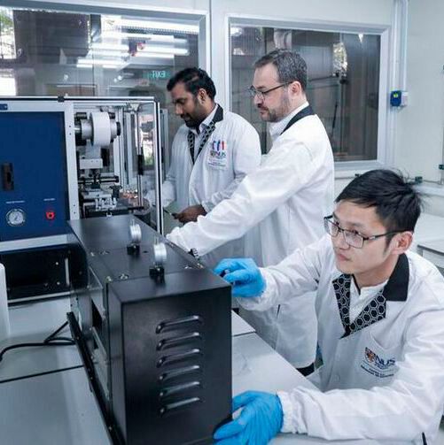 (left to right): NUS CA2DM researchers Dr. Govindan Kutty Rajendran Nair, Dr. Sergio G. Echeverrigaray, and Dr. Yang Jie working in the dry room of the CBMM-CA2DM Advanced Battery Laboratory. (left to right): NUS CA2DM researchers Dr. Govindan Kutty Rajendran Nair, Dr. Sergio G. Echeverrigaray, and Dr. Yang Jie working in the dry room of the CBMM-CA2DM Advanced Battery Laboratory.