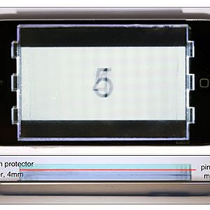 Researchers placed a printed pinhole array mask on top of an iPod touch as part of their prototype display. Shown above are top-down and side-view images of the setup.