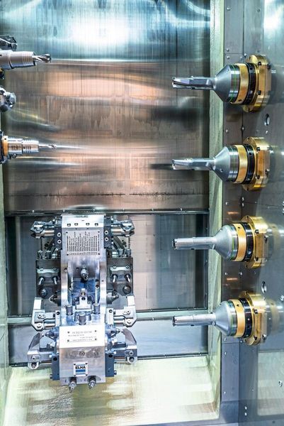 Arrangement of four step drills on the right-hand side of the working area of a production module. (Elha)