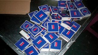 Fake NSK bearings in their packaging found at the production facility of a counterfeiter (NSK)