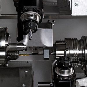 Schnelle und schonende Werkstückabführung der Index ABC65: Mit der CNC-programmierbaren Werkstückabführung lassen sich die Fertigteile problemlos und hauptzeitparallel aus dem Maschinenarbeitsraum abführen. (Bild: Index)