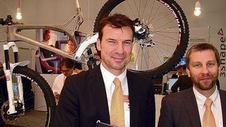 Renishaw's Albert Rundel (l.), product manager, and Robin Weston, marketing manager of the additive manufacturing products division, in front of the titanium frame the company developed with Empire Cycles. (Schulz)