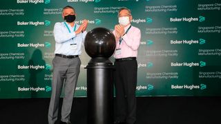 Chairman and CEO Lorenzo Simonelli along with the Minister of Trade and Industry Gan Kim Yong celebrate the opening of the new Singapore chemicals facility. (Source: Baker Hughes Energy Services)