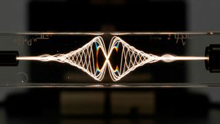 Die schwingenden, sich drehenden Teilchen, Photonen zumeist, scheinen sich als eine mögliche Variante von Quantencomputern zu etablieren.  (Bild: © Rindang Bimantara - stock.adobe.com / KI-generiert)