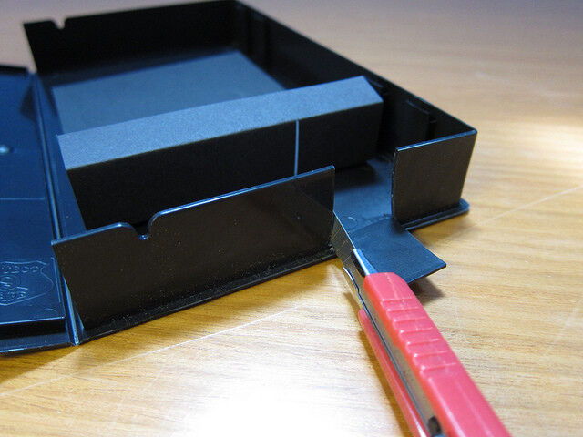 The opening can be a centimeter wide; the black paper just lets you make a more precise slit than you'd get when cutting the box. You can also replace the slit to make it more precise or if it gets damaged. (PLOTS/CC BY 2.0)