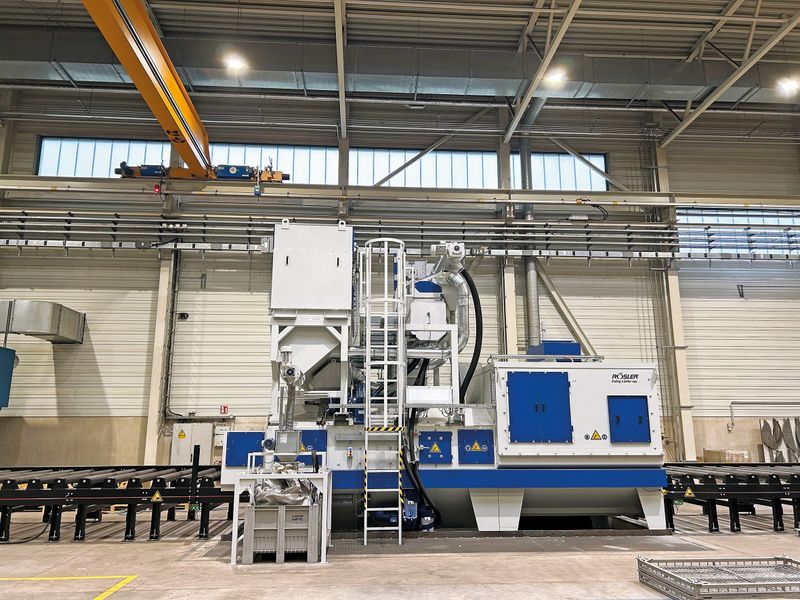 The roller conveyor blast machine, painted in the customer's CI colors, impressed with its clever equipment and turbine concept as well as its performance and quality.(Source:  Bulkhead)