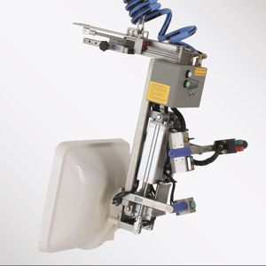 Der Waschtischgreifer: Hantierung durch pneumatische Klemmung, mit 90° Schwenkfunktion und Schwerpunktausgleich. Vario-Steuerung mit Auf-/Ab-Taster sowie Klemmen-/Lösen-Taster.