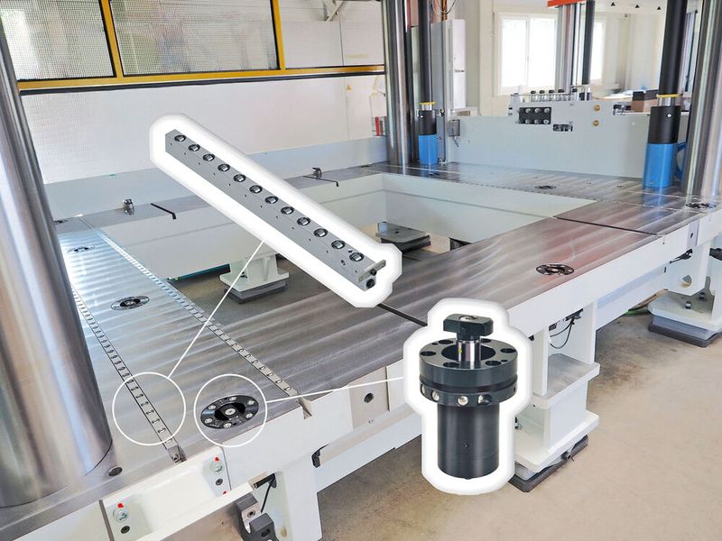 Roemheld double-acting, hydraulically-actuated, swivelling clamping elements are set into the press table to secure the lower half of the trimming die. The clamp design results in interference-free insertion and removal of the heavy dies, assisted by the integration of Roemheld transport rails. (Source: Stephan Auch/ Roemheld)