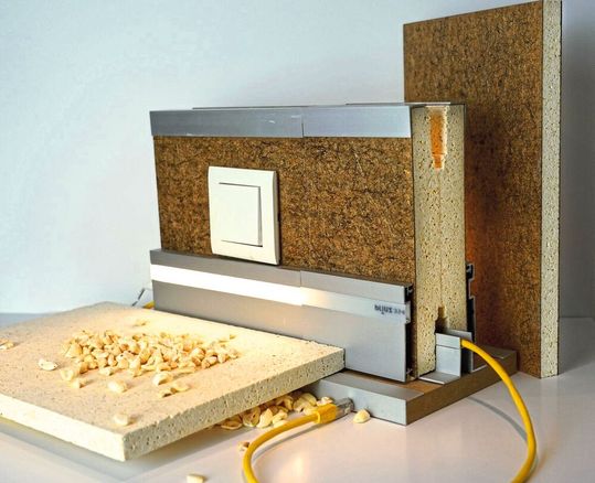 Aus Popcorngranulat stellen Wissenschaftler der Uni Göttingen umweltschonende Paneele für den Trockenbau von Häusern her. Aus Popcorngranulat stellen Wissenschaftler der Uni Göttingen umweltschonende Paneele für den Trockenbau von Häusern her.
