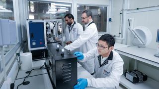 (left to right): NUS CA2DM researchers Dr. Govindan Kutty Rajendran Nair, Dr. Sergio G. Echeverrigaray, and Dr. Yang Jie working in the dry room of the CBMM-CA2DM Advanced Battery Laboratory. (Source: NUS)