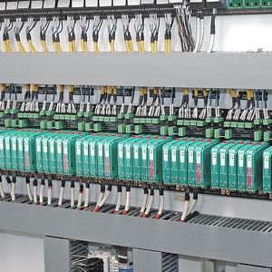 The control room cabinet: Each plug-in module powers and connects up to 32 field instruments to the DCS. 