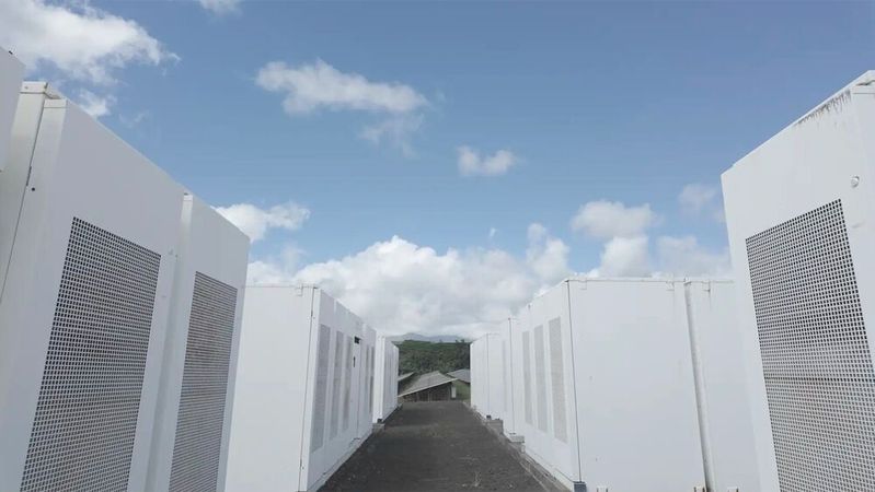 Rows of batteries on Kauai island provide more than just power: They stabilize the grid. A project between the Kauai Island Utility Cooperative, NLR, and several more partners showed that electronics can offer equal grid strength to spinning resources. (Source:  Connor O’Neil, National Laboratory of the Rockies)