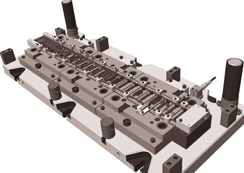Das mit Visi konstruierte Werkzeug und die damit produzierten Kontaktelemente für das Stecker-Kupplungssystem, über das Elektroautos ihre Energie beziehen sollen. (Bild: Mecadat)