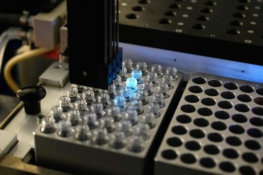Close up of the semi-automated synthesis robot used to generate training data. Close up of the semi-automated synthesis robot used to generate training data.
