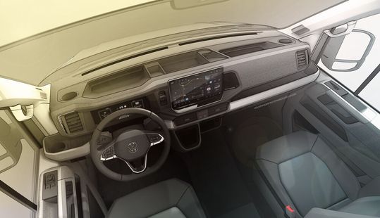 Einblick in das neue „Digital Cockpit“ des weiterentwickelten VW Crafter: mit neuer elektronischer Parkbremse für mehr Platz im Durchstieg, neuem Multifunktionslenkrad und neuem Automatikwählhebel wie beim ID.Buzz.(Bild:  VWN)