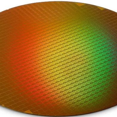 A semiconductor wafer manufactured by Micron containing memory ICs. With the help of the CHIPS and Science Act, Micron will make what it claims is the largest investment in memory chips in U.S. history. (Image:Micron)