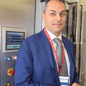 Sebastiano Nastasi, sales and technical director with Schmucker, with a stick packaging machine