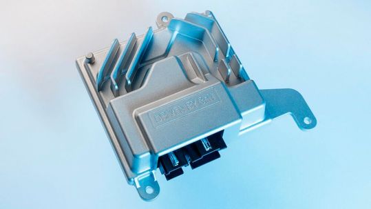 A GaN‑based power amplifier drives the 400 W subwoofer while enabling a more compact and lightweight automotive audio system.(Source:  Porsche)