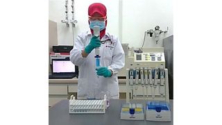 Animal feed analysis at Sumitomo's research base in Malaysia. (Sumitomo Chemical)