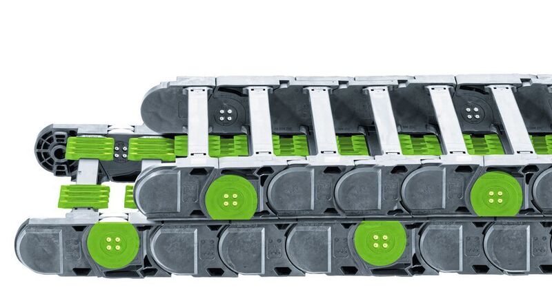 2006: Mit dem Rollen-Energieketten-System P4 lassen sich lange Verfahrwege, hohe Beschleunigungen, Geschwindigkeiten und Füllgewichte mit gleichzeitig leisem Lauf realisieren. Die Rollen des Obertrums laufen beim System P4 nicht übereinander, sondern versetzt durch die des Untertrums und werden durch kammartige autoglide-Stege unterstützt. (Igus GmbH)