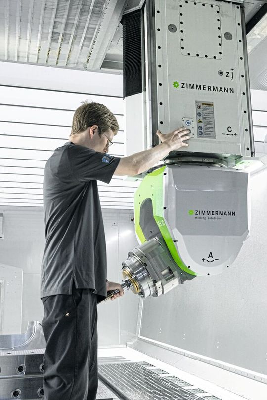 David Hawes, machine operator at Century, places the tools on the spindle of the Zimmermann machine.(Image: Ivette Gersh Photography)