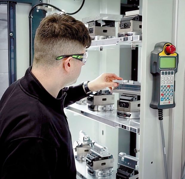 Dominic Roach removing a part from the multi-level Erowa pallet store. (Source: Whitehouse Machine Tools )