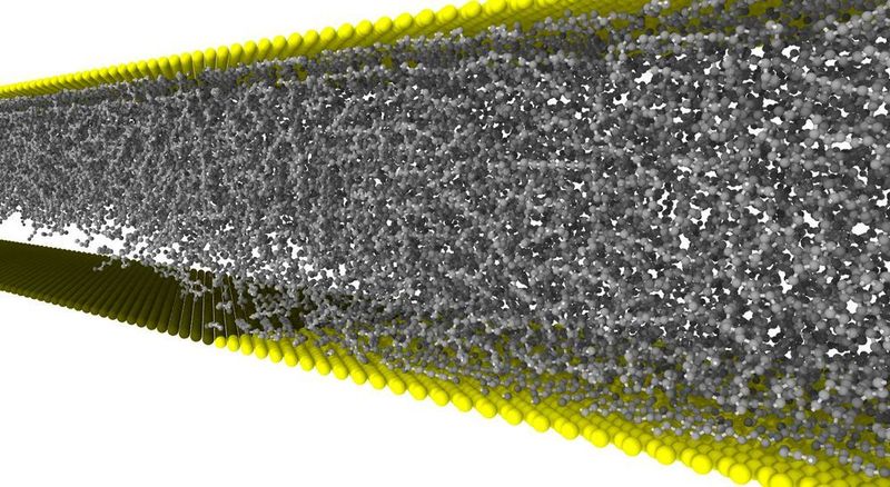 Eine Kavitationsblase entsteht im Schmiermittel zwischen Öl-anziehender (gelb) und
Öl-abstoßender Fläche (schwarz). Als Puffer könnte sie Verschleiß reduzieren. (Bild: KIT)