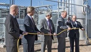 Wyoming Governor Matt Mead (second from right) works the cable cutter during Thursday's cable-cutting ceremony at the Microsoft Data Plant on the grounds of the Dry Creek Water Reclamation Facility in Cheyenne, Wyoming Cheyenne with Mayor Richard Kaysen, far right. From left are Sean James, Microsoft's Senior Research Program Manager/Data Center Advanced Developer; Steve Six, Siemens' Business Development Manager for Power Distribution Solutions, and Tony Leo, FuelCell Energy's Vice President of Applications and Advanced Technology Development. (Bree Anderson/Wyoming Business Council)