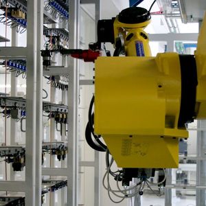 A close-up of the ceiling-mounted robot.