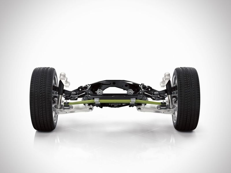 Anstatt der sonst üblichen Schraubenfedern wird an dem Fahrwerk des neuen Volvo XC90 eine quer eingebaute faserverstärkte Komposit-Blattfeder eingesetzt. Benteler-SGL produziert diese Komposit-Blattfeder mit Loctite Matrixharz von Henkel in Großserie. (Bild: Henkel)