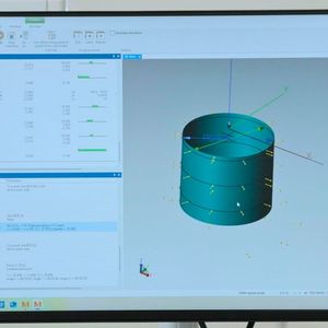 The dimension inspection process for the workpiece reference. The measurement software interface is displayed on the system monitor, which includes a 3D model of the measured surface of the part and the parameters of the inspection program.(Source:  Mitutoyo Europe)