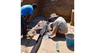 The excavation team uncovering the wooden structure (Source: Professor Larry Barham, University of Liverpool)