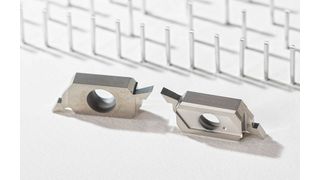 Two S274 indexable inserts in a Wirestyle machine cut nails from a reel of aluminium wire prior to their insertion in a plastic sheet. (Source: Horn Cutting Tools)