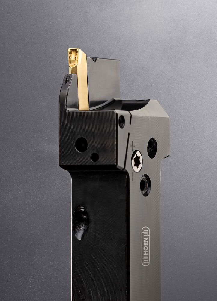 The Horn S224 grooving system for sliding-head lathes has been redesigned with a side tightening, cam lock screw to secure the insert. It avoids having to remove the tool from the lathe to index or exchange the insert.