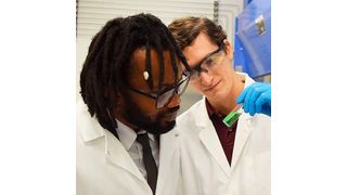 Dr. Abdoulaye Djire (left) and Denis Johnson (right) analyze a coloring solution after an experimental run. A coloring solution is created after each nitrogen reduction reaction experiment, and the level of ammonia produced is indicated by how green the solution turns after a waiting period.  (Texas A&M Engineering)