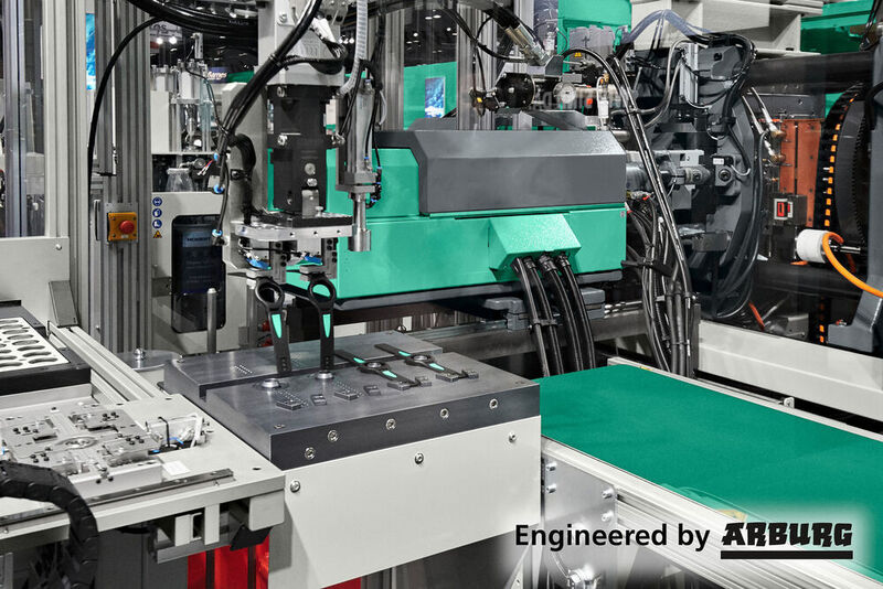 Assembly within injection moulding cycle: a turnkey system uses a hydraulic two-component Allrounder 570 S and a linear Multilift V 15 robotic system to produce two ready-to-use wrist watches in 70 seconds. (© Arburg)
