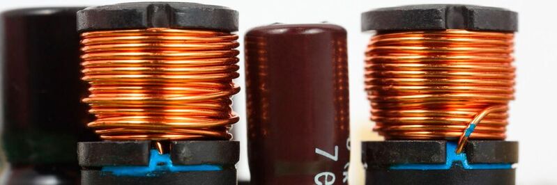 What are inductors, how are they constructed, and what are the different types? 
