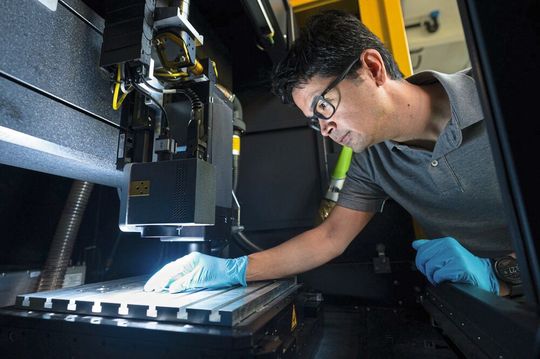 An employee adjusting a DLIP system.(Image: Surfunction)