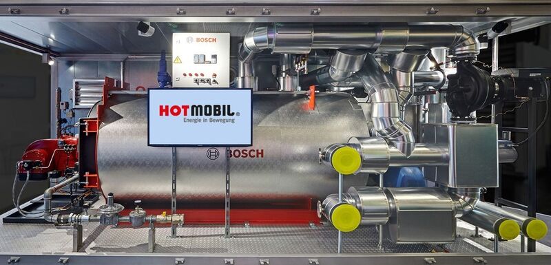 Die mobile Heizzentrale mit integriertem Bosch-Kessel und -Brennwertwärmetauscher leistet bis 1500 kW bei sechs Metern Containerlänge. (Bild: Bosch)