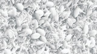 Elektronenmikroskopische Aufnahme der Schichtoberfläche. Zwei unterschiedliche Kristalltypen (kleine, sternförmige Nadeln und größere, linsenförmige Plättchen) liegen nebeneinander vor. (Archiv: Vogel Business Media)