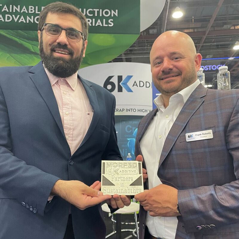 Dr Behrang Poorganji, VP of Materials Technology at Morf3D (L) and Frank Roberts, President of 6K Additive at the Rapid + TCT event in Detroit.